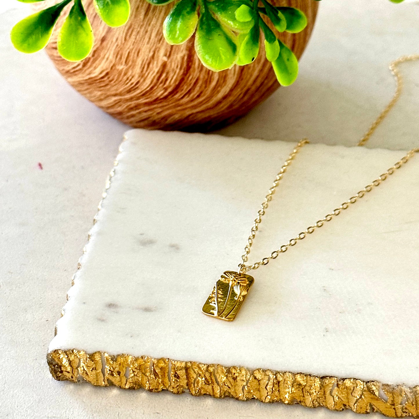 Gold plated floral tag pendant necklace